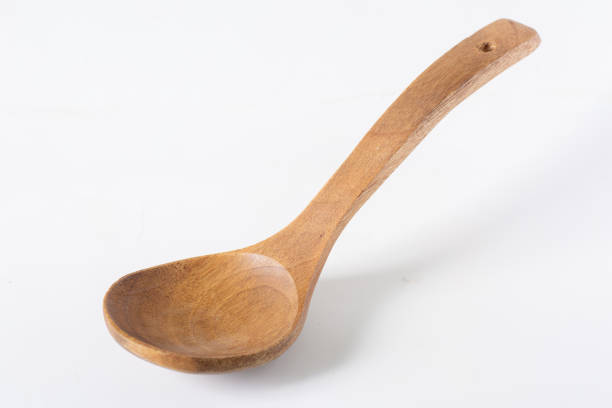 istock Wood bean or bamboo ladle spoon in rustic, vintage style, white background, 1502879972