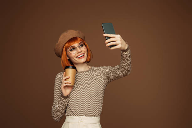 istock Beautiful emotional woman using phone 1502881326