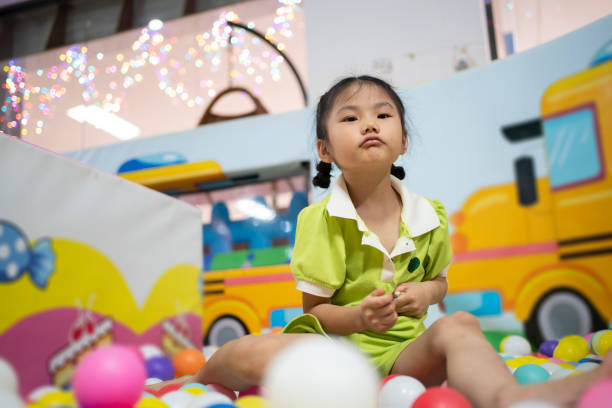 istock Sunny girl playing in children's playground 1502883220