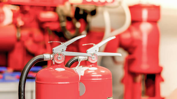 istock The red fire extinguisher is ready for use in case of an indoor fire emergency. 1502883950