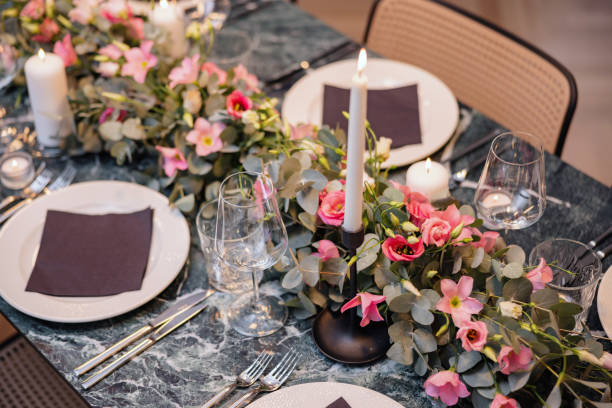 istock Beautiful Table Setting With Flower Arrangements Before A Fancy Dinner Party 1502885076