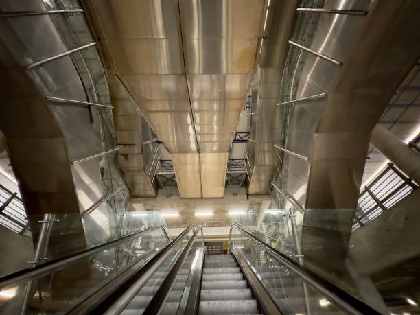 istock Escalators in a concrete parking garage 1502885381