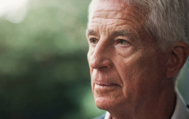istock Senior man, thinking and serious face outdoor at a park or backyard to remember memory or identity. Elderly male person headshot or profile for retirement lifestyle, dementia or Alzheimer problem 1502888363