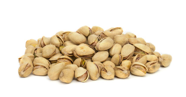 istock Closeup pistachios nut dry roasted and salted isolated on white background 1502888414