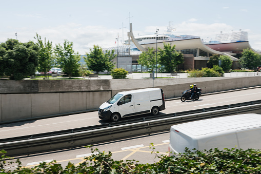 A van in motion in a city