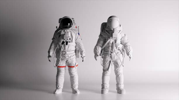 istock Two astronauts in white spacesuits stand on a white background. Lighting is changing. Black and white helmet. 1502890078