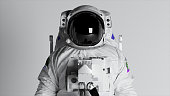 Astronaut's head close-up on a white isolated background with changing lighting. Chroma key. Helmet. Advertising