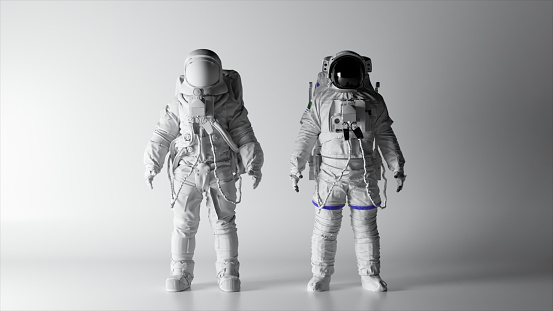 Two astronauts in white spacesuits stand on a white background. Lighting is changing. Black and white helmet. Dark and light. Shadows on the wall. High quality 3d illustration