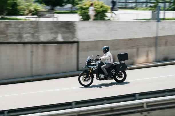 Santander, Spain - 22 June 2023: A BMW F850 GS motorbike in motion in Santander, Spain