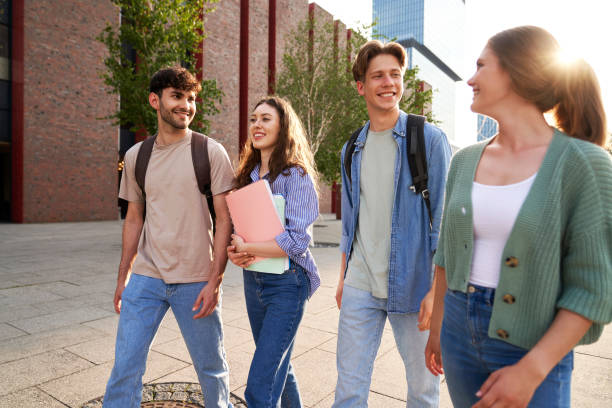 istock Group of caucasian students walking through university campus 1502894065