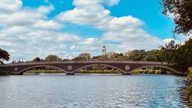 Charles River Boston Massachusetts with Harvard in the back on a sunny day in June.