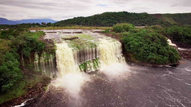 Latin America places video series: Aerial view of Canaima lagoon and El Hacha waterfall. Canaima National Park, Venezuela