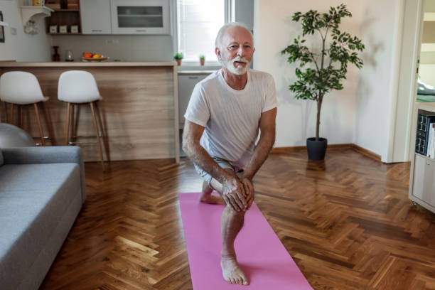 istock Senior man doing fitness workouts and stretching at home. 1502899407