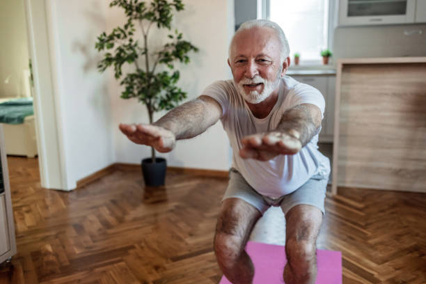 istock Fit senior man exercising at home doing lunges exercise. Mature man stretching at home. 1502900809