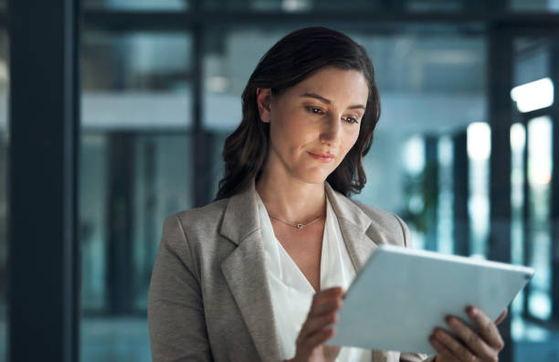 istock Technology, woman on tablet and browsing the internet in her office at her workplace. Online communication or connectivity, social networking or crm and businesswoman writing an email for data review 1502906310
