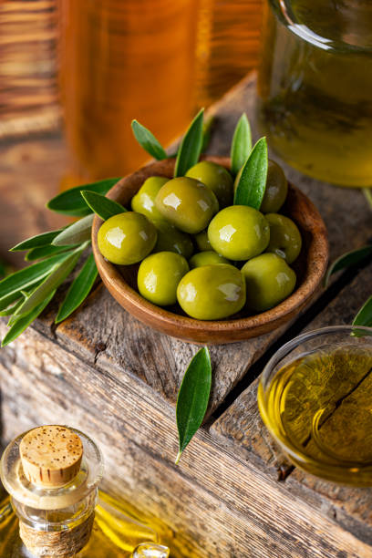 istock Green olives in wooden bowl 1502907219
