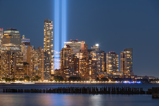 Tribute in Light. The two vertical columns of light rising between the skyscrapers in Lower Manhattan. New York City