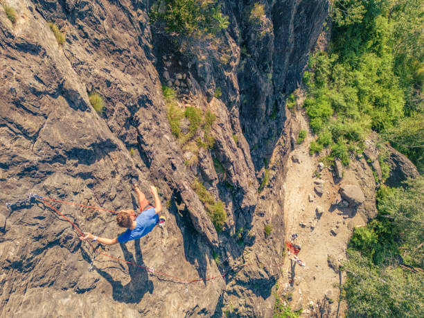 istock Man rock climbing in summer on steep wall outdoors 1502909771