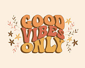 Groovy lettering Good vibes only. Retro slogan on a rainbow background. Trendy groovy print