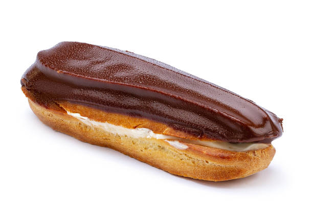 istock Traditional french dessert. Isolated eclair with custard and chocolate icing on white background. Sweet pastry products 1502916247