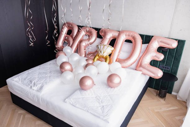 istock Pink Balloons On The Bed Spelling Bride 1502917014