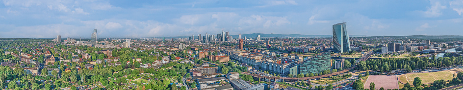 Wide angle drone panorama over the German city Frankfurt am Main during sunrise in summer