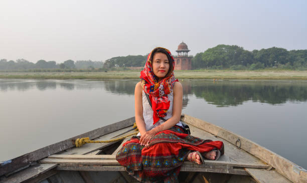istock A woman watching sunset over Taj Mahal 1502919241