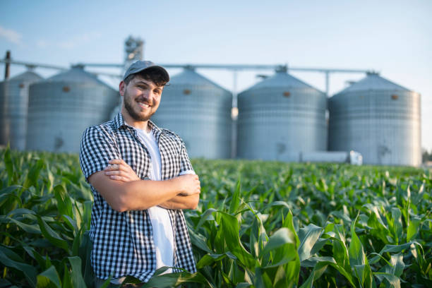 istock Portrait of confident farmer standing in the corn fields. 1502921534
