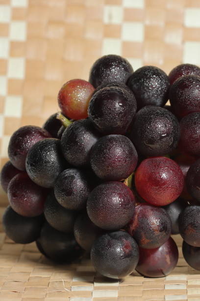 istock Red grapes on wooden background 1502921898
