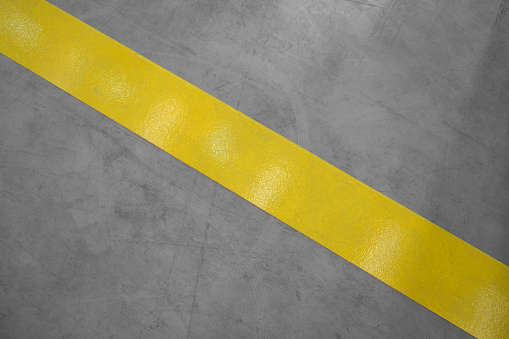 Grey floor and yellow lines