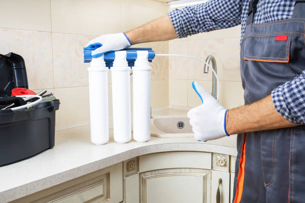 istock plumber man with equipment gesturing thumb up in apartment 1502927212