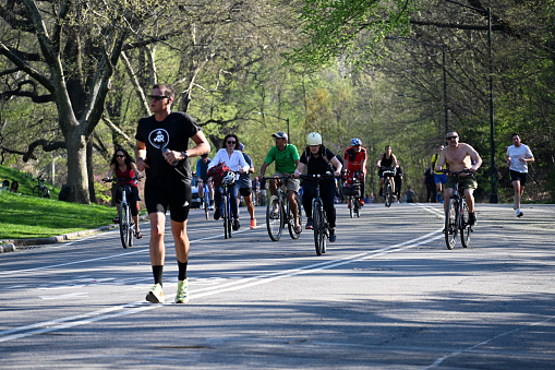 New York, USA, April 13, 2023 - tourists, joggers, walkers and cyclists in the Central Park New York.