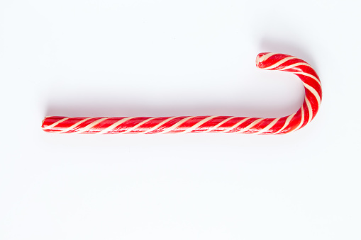 Christmas Decoration with Candy Canes on snow background