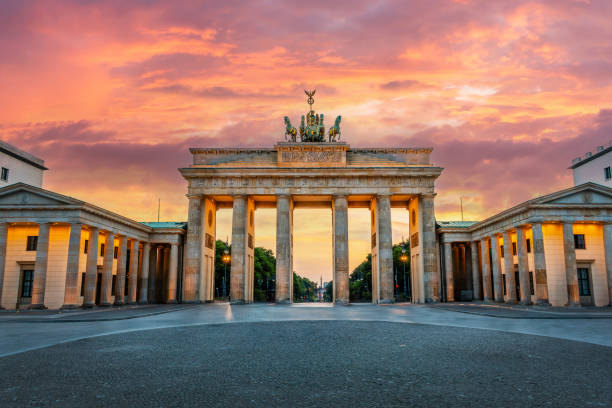 Brandenburg gate illuminated at sunset in Berlin, Germany