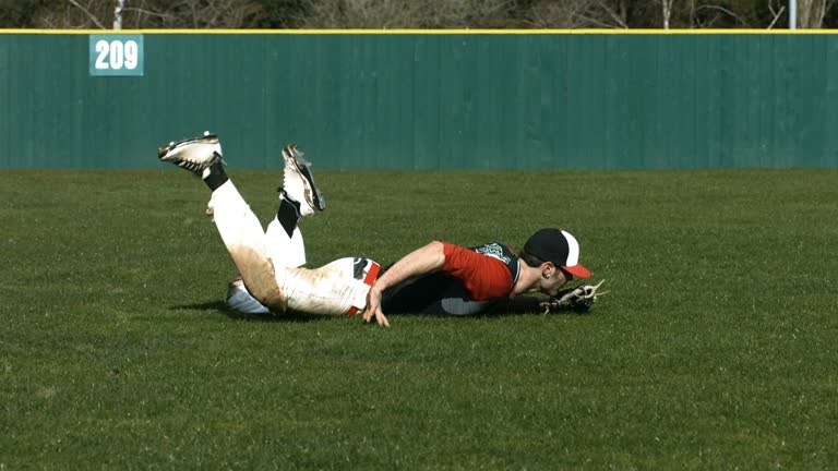 Baseball player catching ball, slow motion