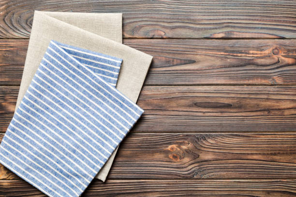 istock top view with blue kitchen napkin isolated on table background. Folded cloth for mockup with copy space, Flat lay. Minimal style 1502932977