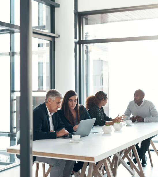 Meeting, board room and office with teamwork, planning and lawyer discussion with tech. Conference, company staff and communication together with cooperation, talking and speaking about b2b plan