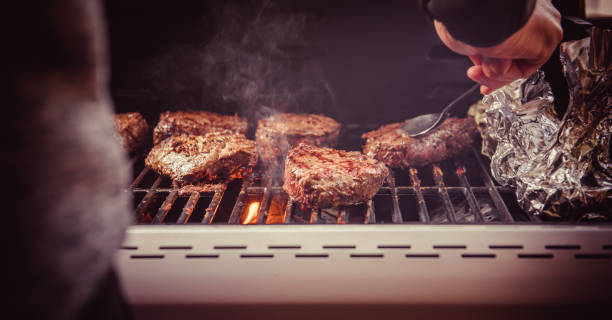 istock Cooking Steaks on grill with fire. BBQ theme. 1502936056