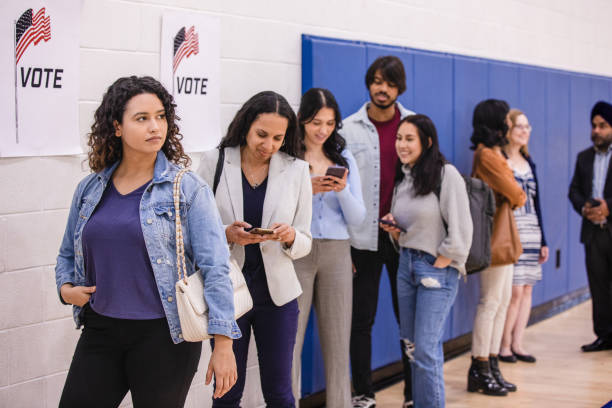 istock Long line of diverse people wait patiently to vote 1502936687