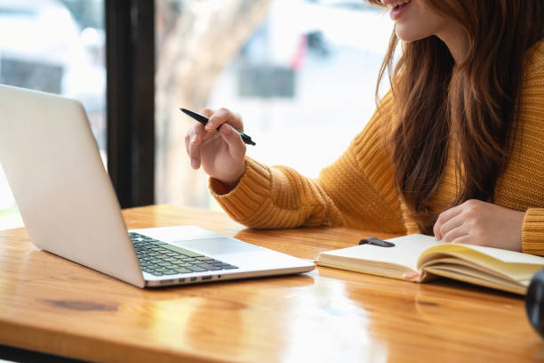istock Happy latin girl college student watching distance online learning class, remote university webinar or having talk on laptop video call and use notebook to virtual meeting seminar at home or campus 1502936717