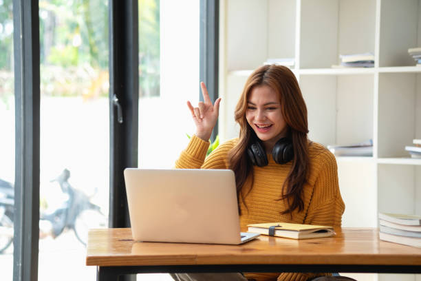 istock Happy latin girl college student watching distance online learning class, remote university webinar or having talk on laptop video call and use notebook to virtual meeting seminar at home or campus 1502937293