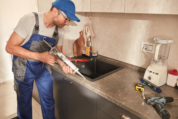 istock Handyman fixing kitchen cabinets in the apartment. 1502937321