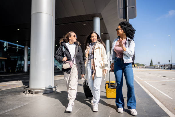istock Friends walking while talk at the airport 1502937518