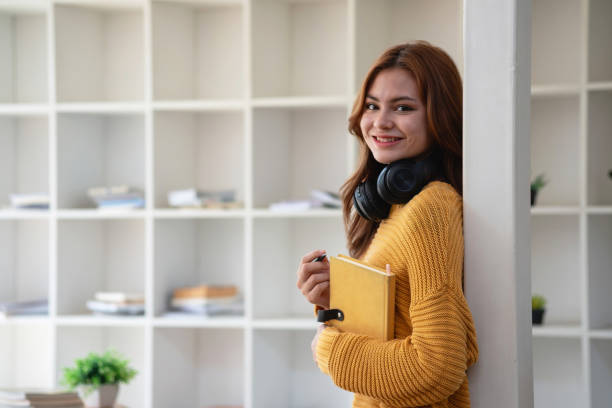 istock Happy latin girl college student watching distance online learning class, remote university webinar or having talk on laptop video call and use notebook to virtual meeting seminar at home or campus 1502937566