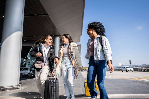 istock Friends walking while talk at the airport 1502937578