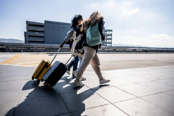 istock Friends walking at the airport 1502937605