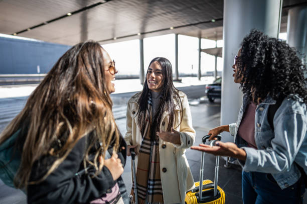 istock Friends talking at the airport 1502937817