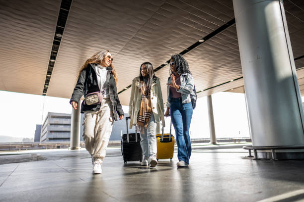 istock Friends walking while talk at the airport 1502937825
