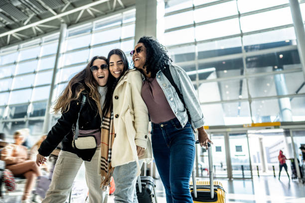 istock Friends walking while talk at the airport 1502937899