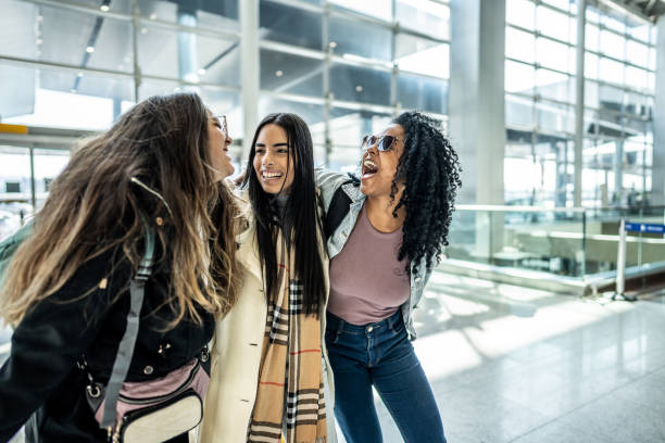istock Friends walking while talk at the airport 1502938439